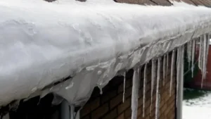 Icicles on snowy roof