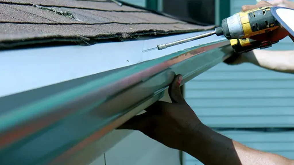 Installing gutter with drill